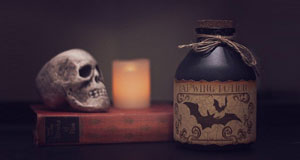 image of spooky skull and poison bottle